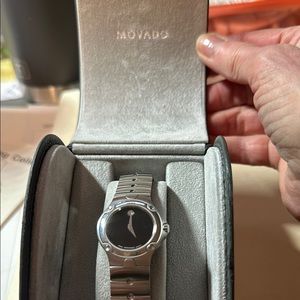 Silver Smartwatch with Sleek Design and Minimalist Face. Museum black dial